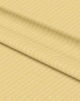 Pastel yellow fabric with white dashed raindrop-inspired stripes – April Showers by Kirsty Gadd SG24-L83