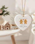 Heart-shaped ceramic ornament featuring a gingerbread Mr & Mr couple with the text ‘Our First Christmas Engaged – Alex & James 2025,’ a personalised gay couple Christmas decoration.