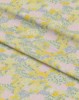 Soft pastel fabric with a scattering of yellow, pink, and lilac garden florals on a light sage green base — inspired by my Grandad’s spring garden. On cotton fabric.