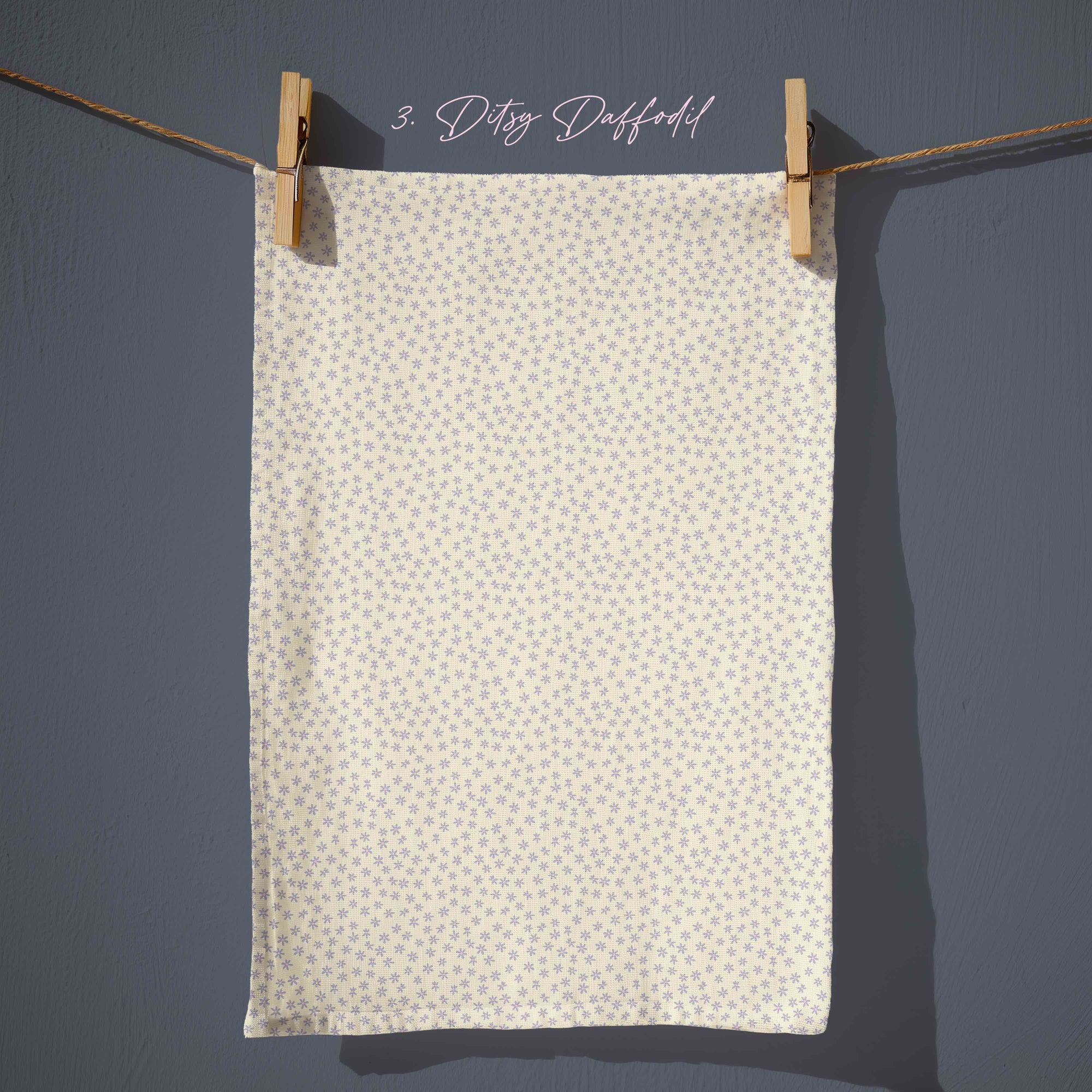 soft yellow ditsy floral tea towel with tiny scattered lilac flowers, vintage country kitchen pattern inspired by spring daffodils.