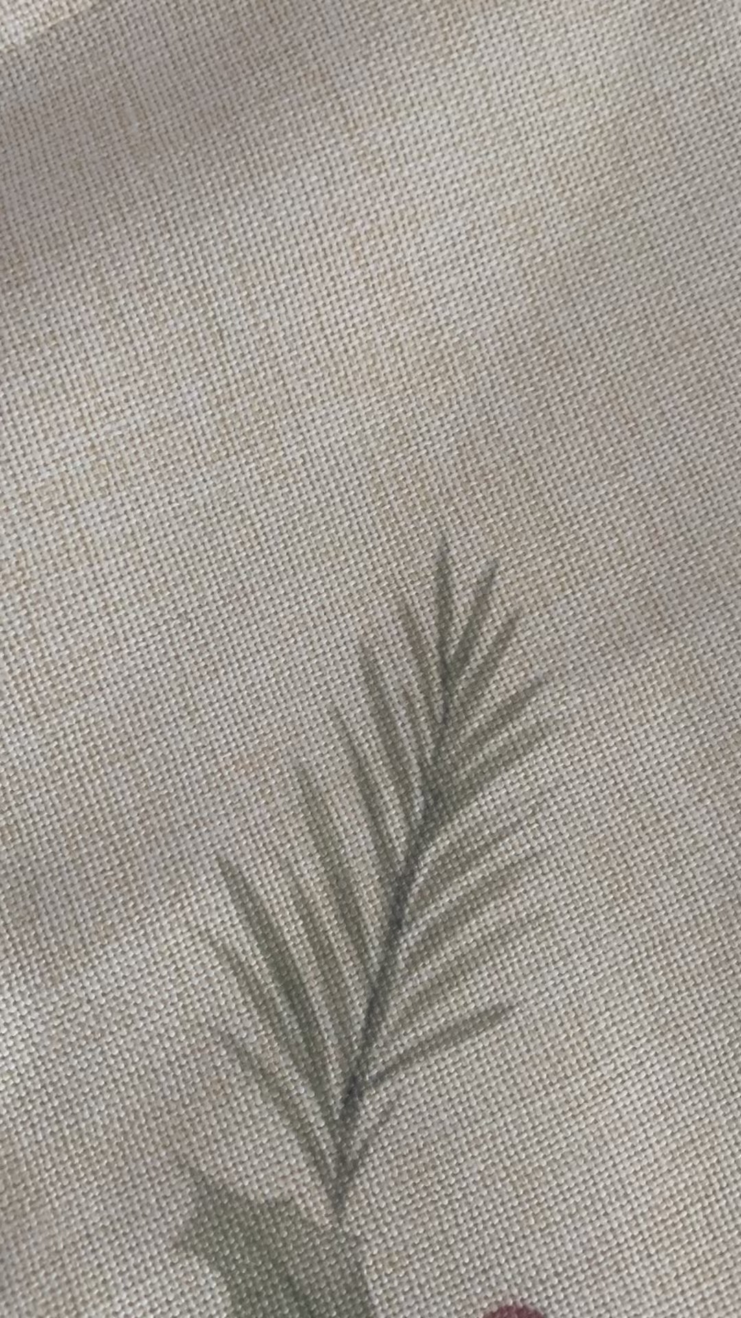 This video shows a close-up view of a personalised penguin Christmas sack made from thick linen-style fabric. The camera moves slowly around the sack to highlight the texture of the material, the printed penguin artwork, and the bright red drawcord ties. The lighting is soft and warm, giving the sack a cosy, festive feel. The movement focuses on the quality of the print and the fabric thickness, demonstrating how the sack holds its shape and gathers neatly at the top.